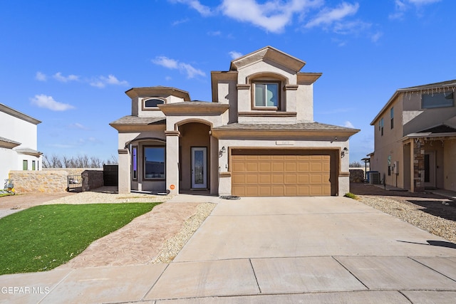 view of front of home featuring a garage and cooling unit