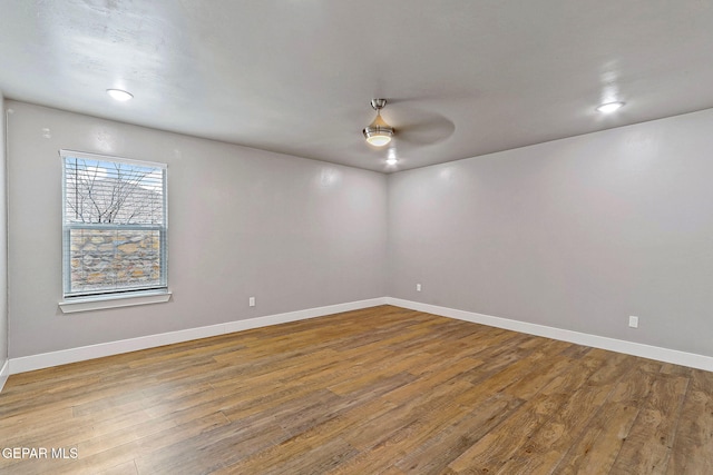 spare room with hardwood / wood-style flooring