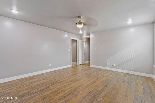 unfurnished room featuring hardwood / wood-style flooring