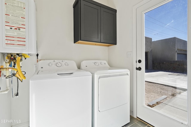 laundry room with cabinets and washing machine and dryer