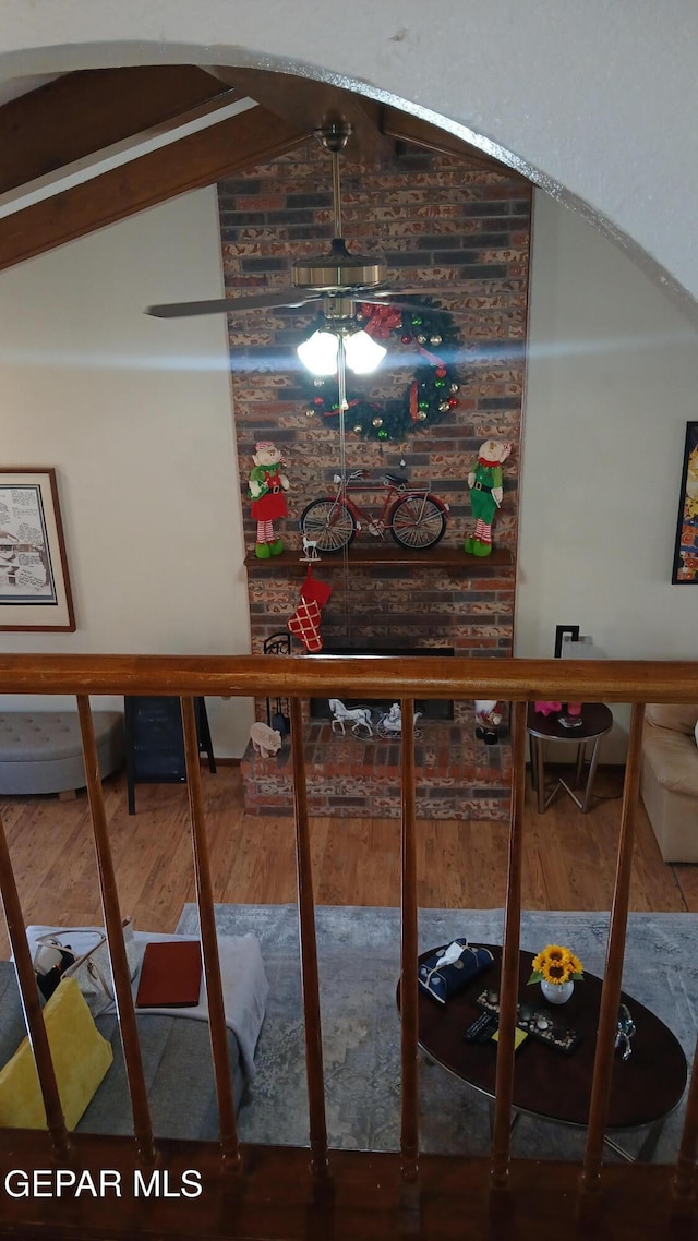 interior space featuring vaulted ceiling with beams and hardwood / wood-style flooring