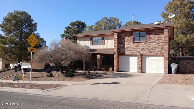 traditional home with brick siding, driveway, and an attached garage