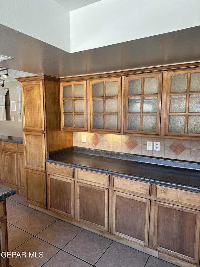 kitchen featuring light tile patterned flooring and a textured ceiling