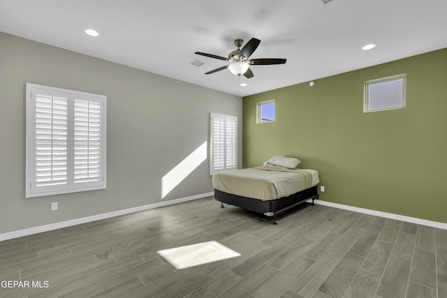 unfurnished bedroom with light hardwood / wood-style floors and ceiling fan