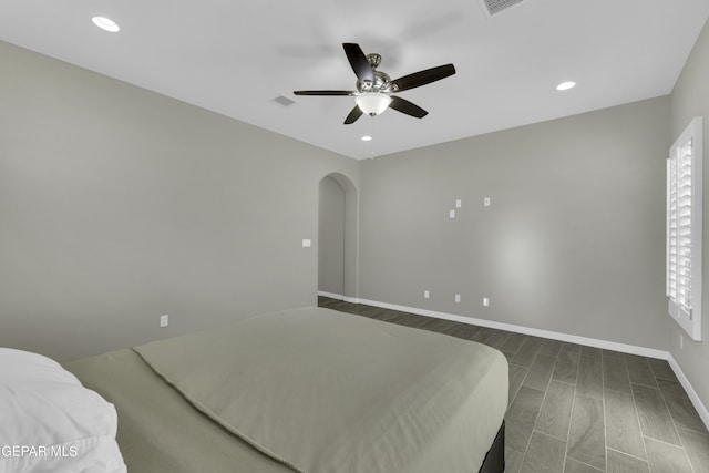 bedroom featuring dark hardwood / wood-style floors and ceiling fan