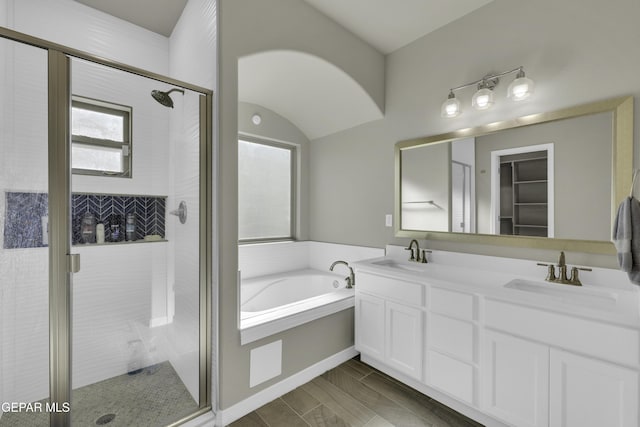 bathroom featuring vanity and plus walk in shower