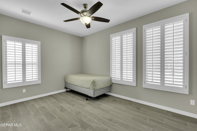 unfurnished bedroom featuring ceiling fan and light hardwood / wood-style flooring