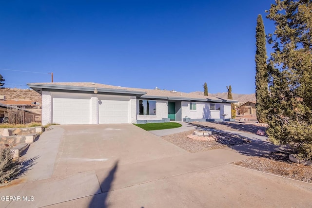 single story home featuring a garage