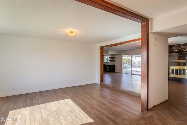 unfurnished room featuring wood-type flooring