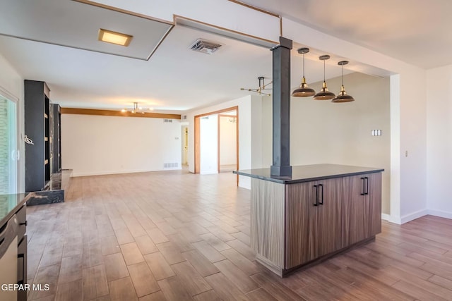 kitchen featuring ceiling fan and pendant lighting