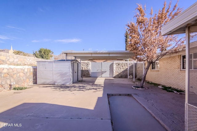 view of patio / terrace with a storage shed