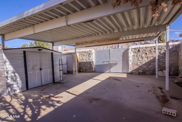 view of patio featuring a storage shed