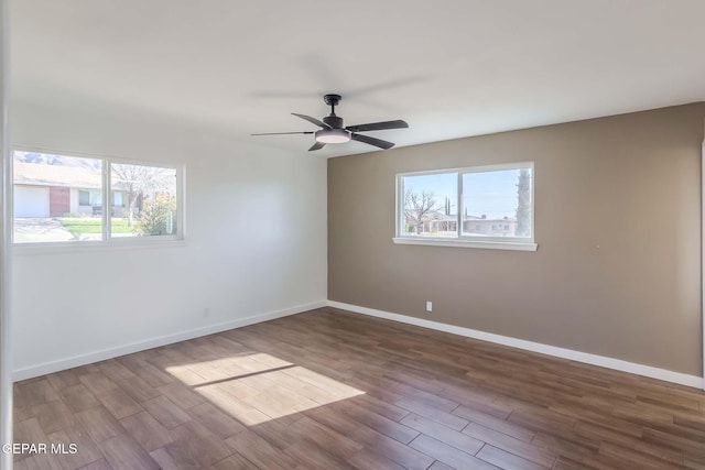 empty room featuring hardwood / wood-style floors and ceiling fan