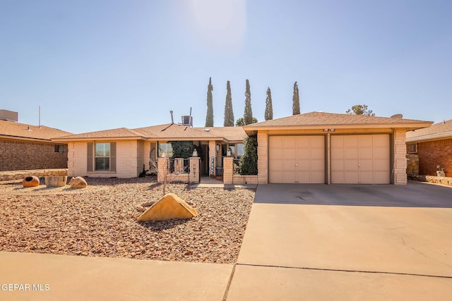 ranch-style home featuring a garage