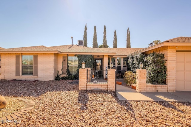 ranch-style home featuring central AC unit