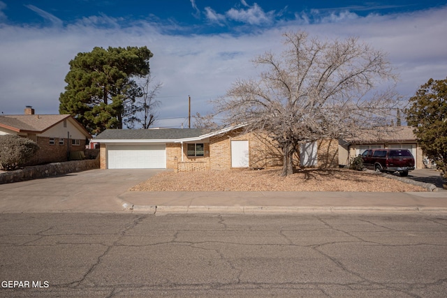 single story home featuring a garage