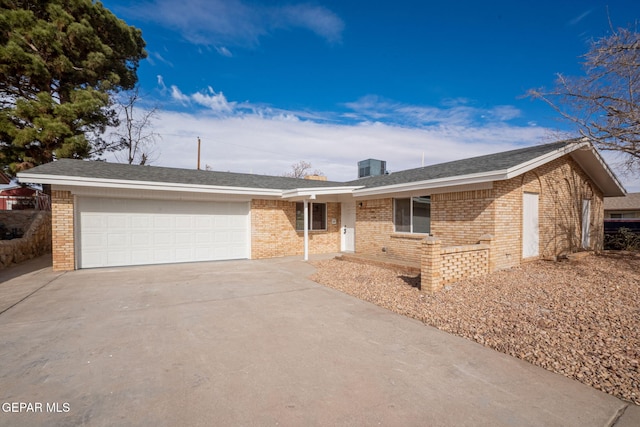 ranch-style home featuring a garage