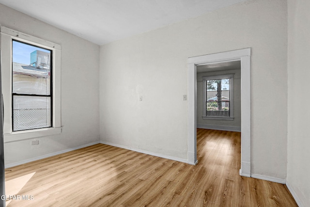 unfurnished room with light hardwood / wood-style floors