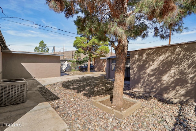 view of yard featuring a patio area and cooling unit