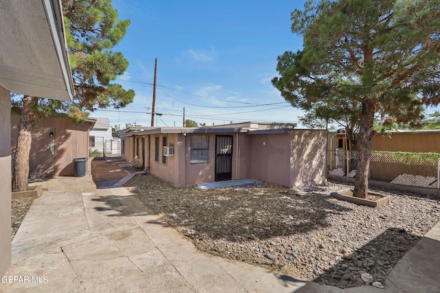 rear view of house with a patio