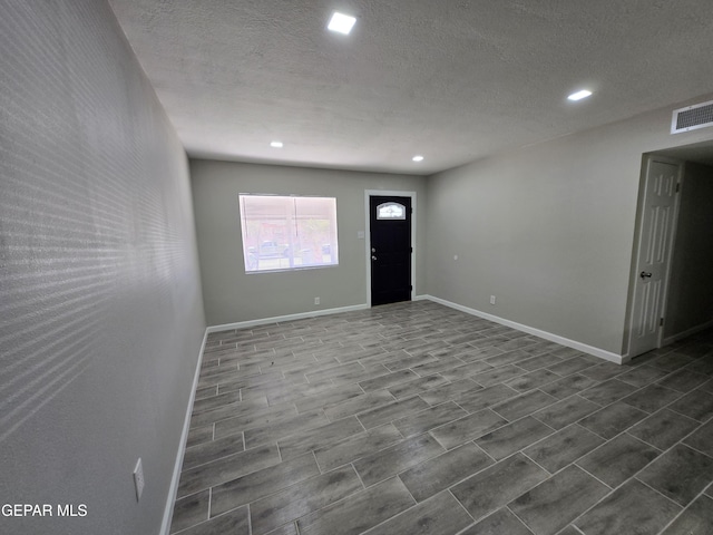 interior space featuring a textured ceiling