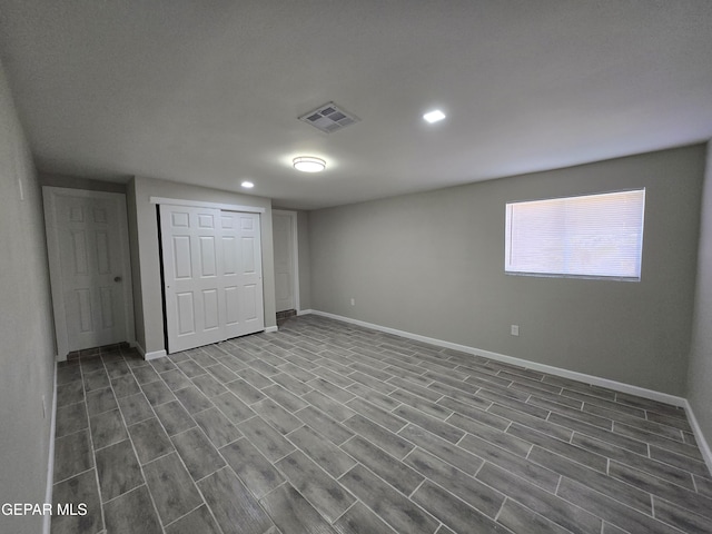 basement featuring light hardwood / wood-style floors