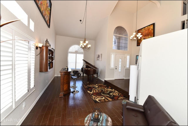 550 Shadow Willow Dr, El Paso, TX 79922 - interior space featuring a high ceiling, dark hardwood / wood-style floors, and a notable chandelier