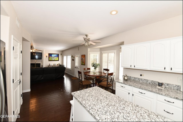 550 Shadow Willow Dr, El Paso, TX 79922 - kitchen with white cabinetry, dark hardwood / wood-style flooring, ceiling fan, and light stone countertops