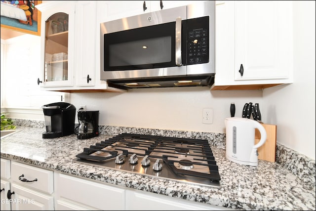 550 Shadow Willow Dr, El Paso, TX 79922 - kitchen featuring white cabinetry, stainless steel appliances, and light stone counters