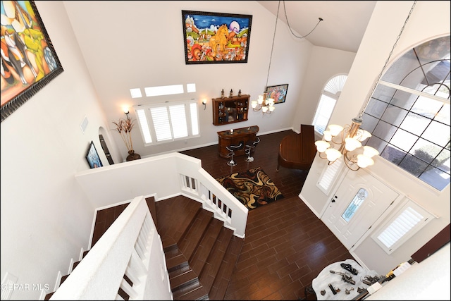 550 Shadow Willow Dr, El Paso, TX 79922 - interior space featuring a high ceiling, dark wood-type flooring, and a notable chandelier