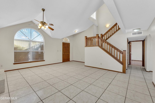 unfurnished living room with ceiling fan, light tile patterned floors, and lofted ceiling