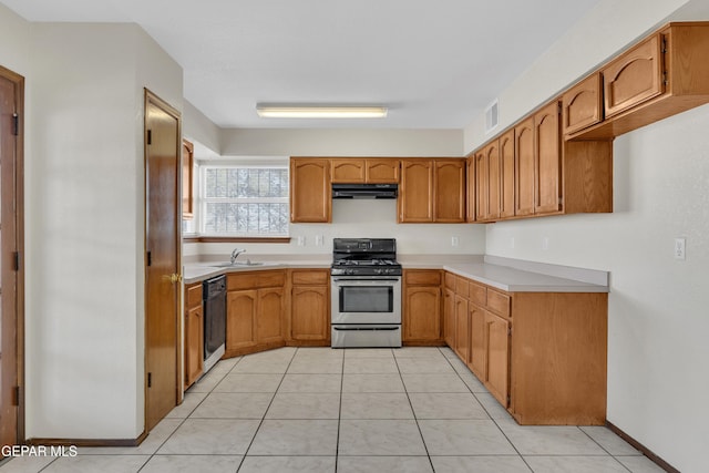 kitchen with stainless steel gas stove, sink, light tile patterned floors, and black dishwasher