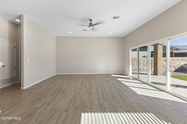 unfurnished living room featuring ceiling fan