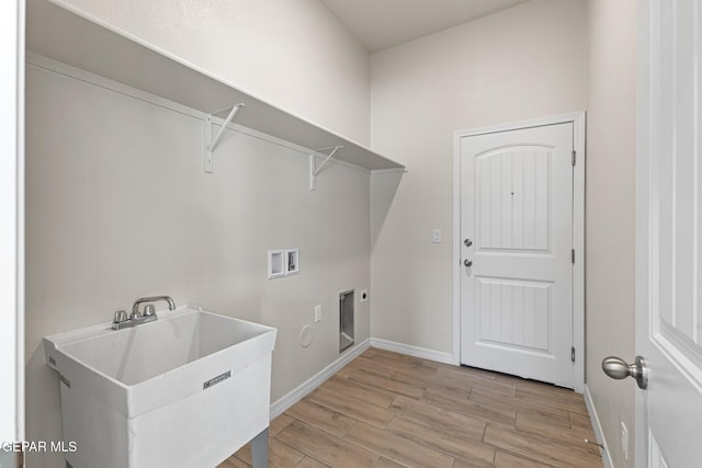 laundry room with washer hookup, hookup for an electric dryer, and sink