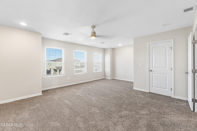 unfurnished room featuring carpet flooring and ceiling fan