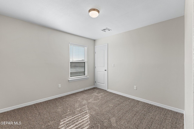 spare room with carpet floors