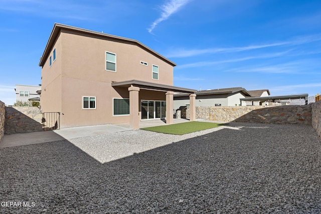 rear view of house featuring a patio area