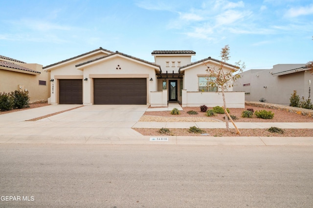 mediterranean / spanish house featuring a garage