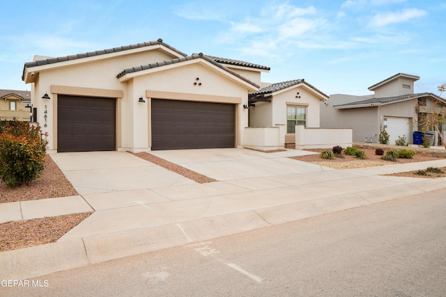 mediterranean / spanish home featuring a garage