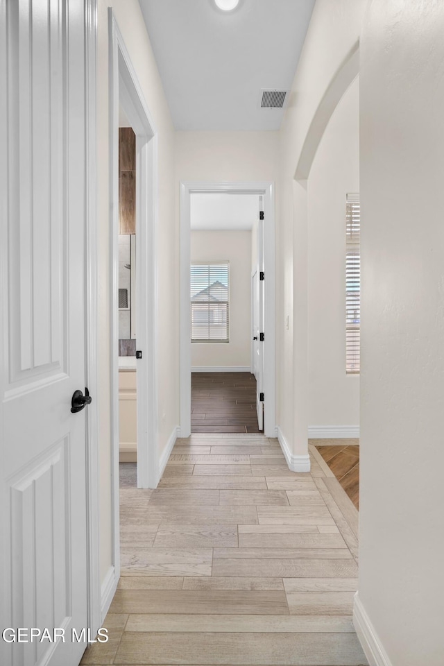 hallway featuring light wood-type flooring