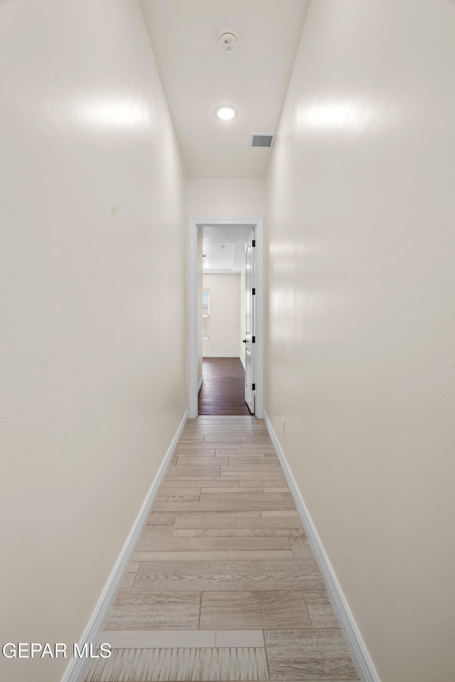 corridor featuring light hardwood / wood-style flooring