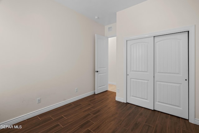 unfurnished bedroom featuring a closet