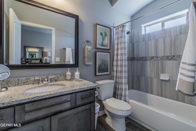 full bathroom featuring vanity, shower / bath combo, and toilet