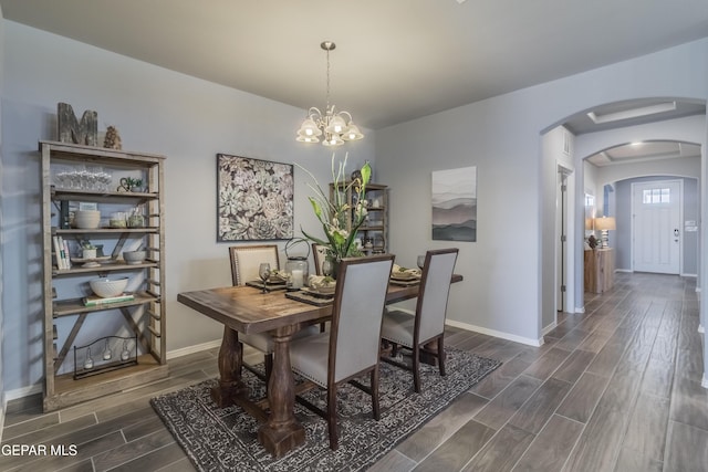 dining area with a notable chandelier