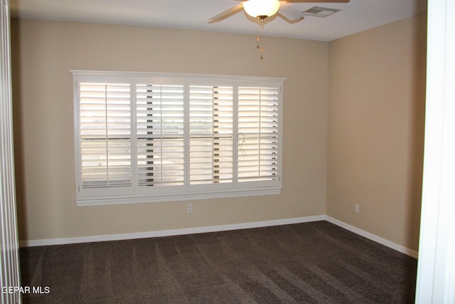 carpeted empty room featuring ceiling fan and a healthy amount of sunlight