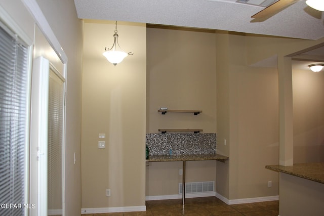 interior space with dark tile patterned floors