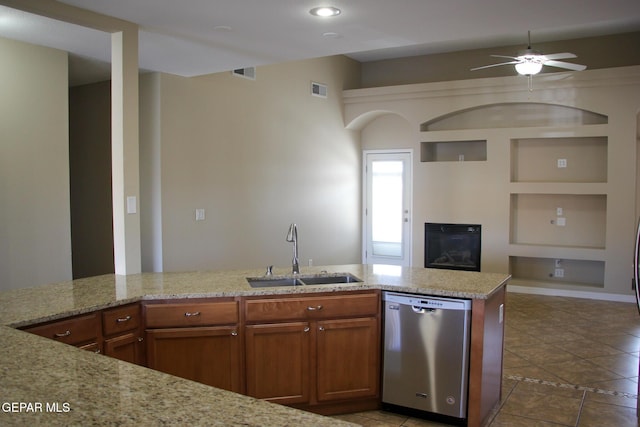 kitchen featuring stainless steel dishwasher, ceiling fan, and sink