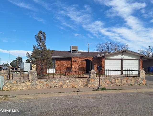 view of front of property featuring a garage