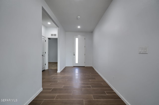 entryway featuring visible vents, baseboards, and dark wood-style flooring