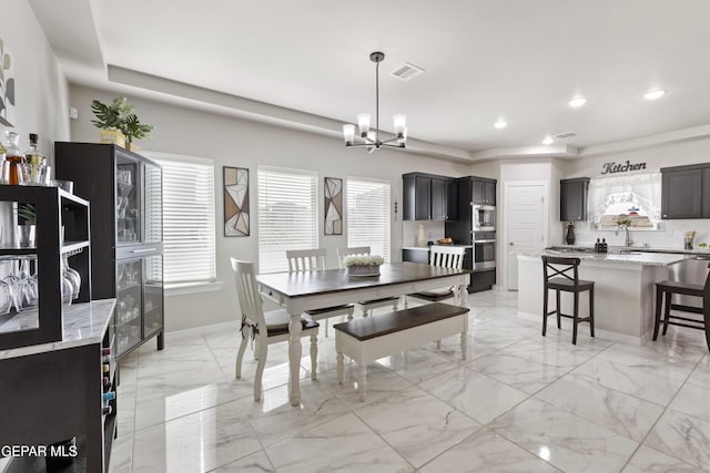 dining area featuring a chandelier